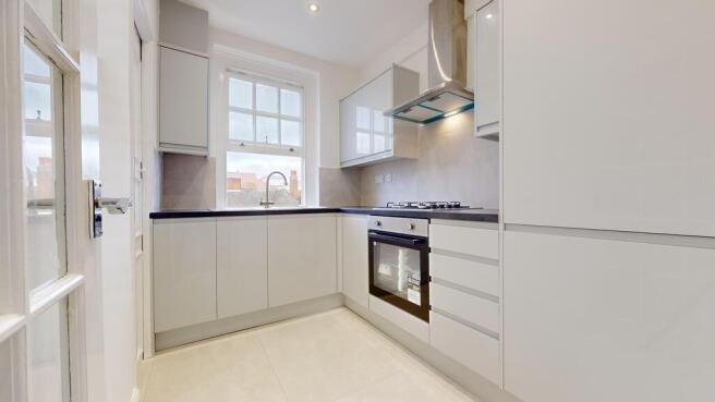 Sleek modern kitchen with bright natural light...