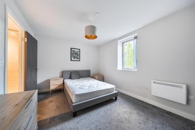 Bright modern bedroom with ample floor space...