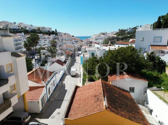 View of Rua dos Pescadores street in Carvoeiro, Algarve, showing proximity to the sea. Central residential area perfect for the Fisherman's Dream luxury project development.