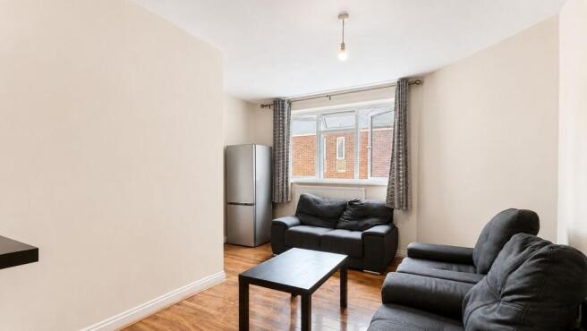 Bright and tidy lounge with comfortable seating...