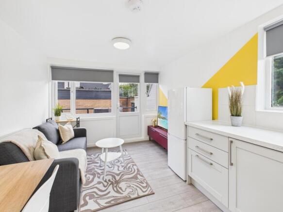 Bright, modern living area with large windows, ...