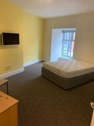 Bright, well-presented bedroom with a sizable w...