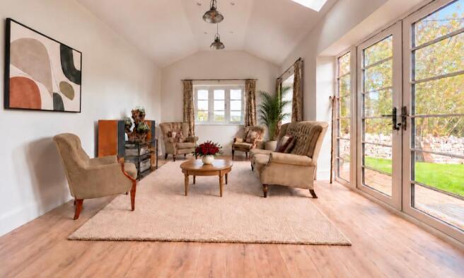 Garden room with tall vaulted ceiling