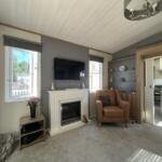 Comfortable Lounge With Feature Fireplace And Wall