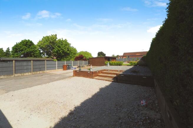 Another great shot of the rear garden and rear driveway