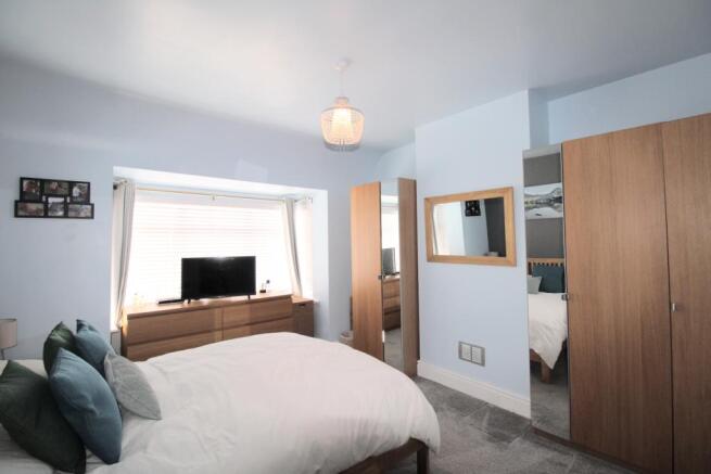 Bedroom one with fitted wardrobes
