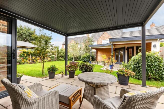 Rear Patio With A View To Summer House