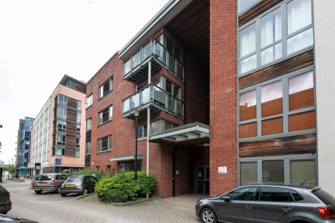 Modern brick and glass apartment building on a ...