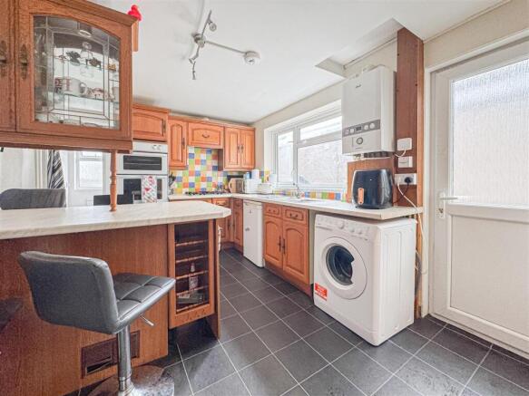 Spacious kitchen with breakfast bar and seating...
