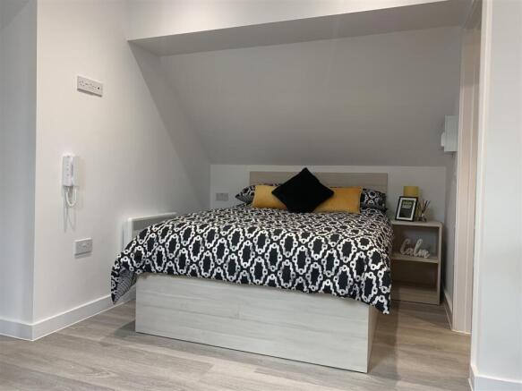 Cosy double bed with modern minimalist decor...