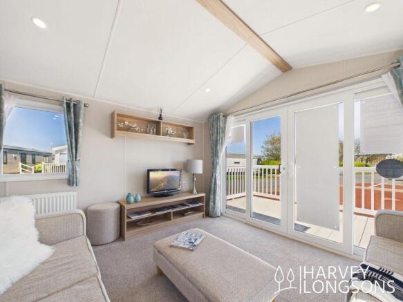 Willerby Malton lounge with patio doors and deckin