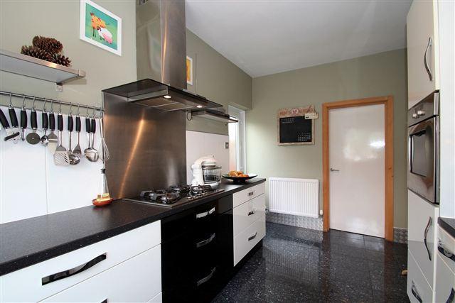Kitchen leading to Utility