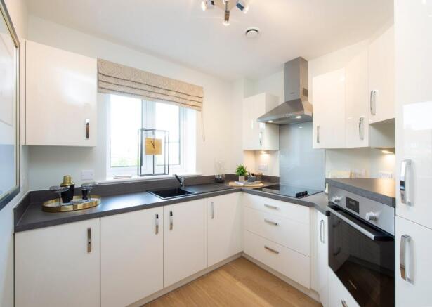 a kitchen with white cabinets