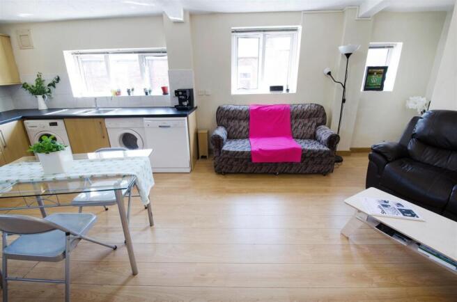 Bright open-plan living space with dining area...