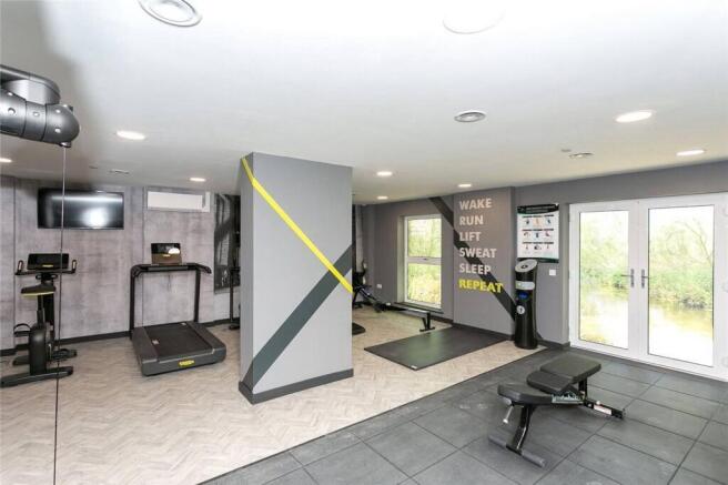 Modern fitness suite with professional equipmen...