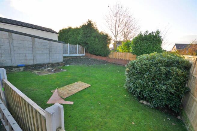 Rear garden, patio and outhouse