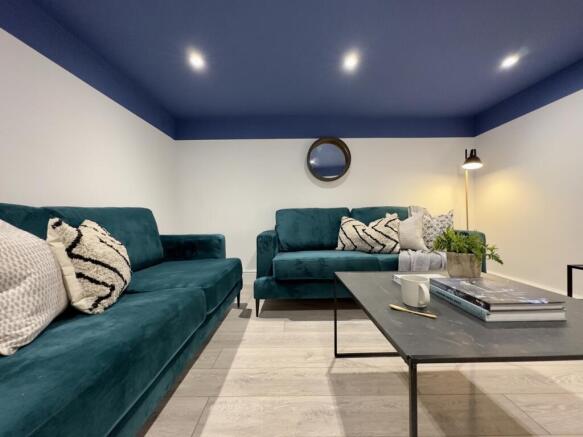 A stylish and spacious modern living room, perf...