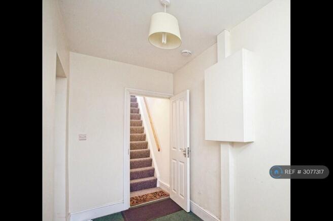 Communal Entrance Leading To Private Stairwell.  