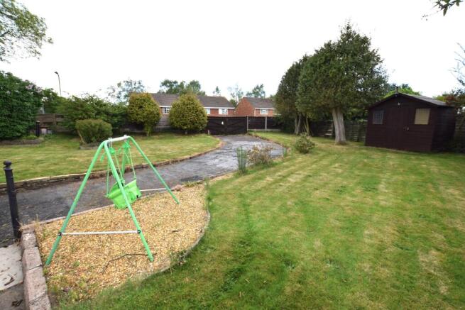 garden & driveway to the rear