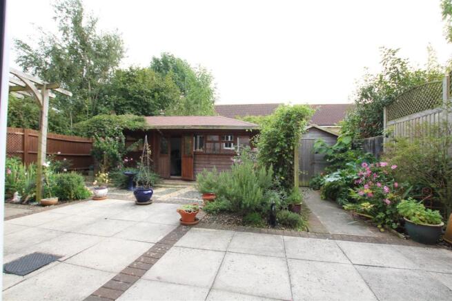 TO THE REAR OF THE PROPERTY