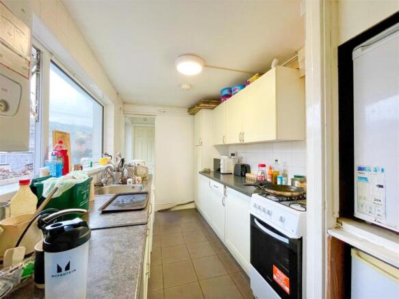 Bright kitchen with ample storage and appliance...