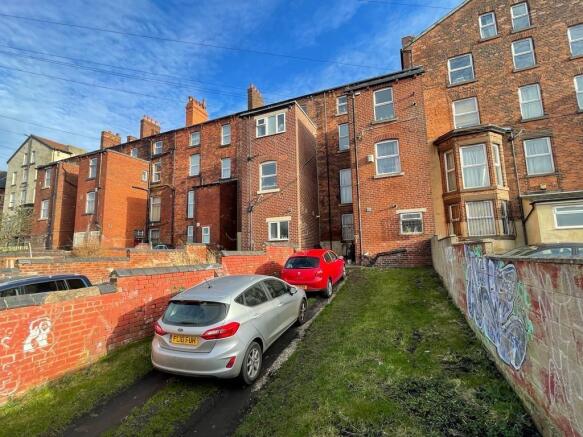 Traditional brick terrace under a bright blue s...
