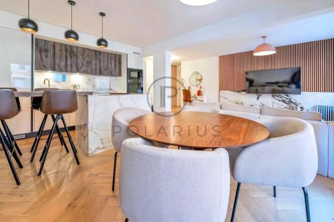 Modern dining and living area with a wooden table,