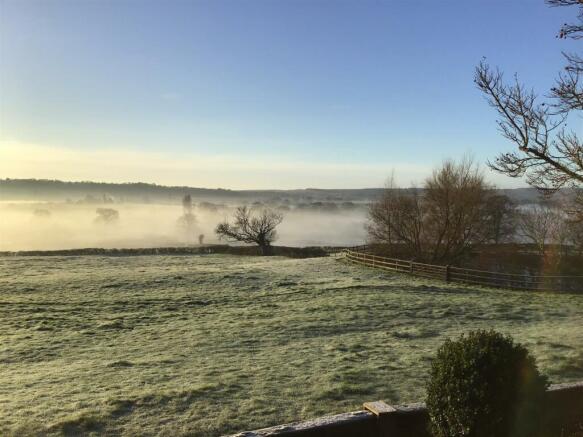 view over fields misty.jpg
