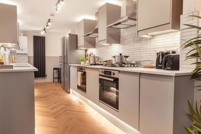 Modern kitchen with integrated dual ovens....
