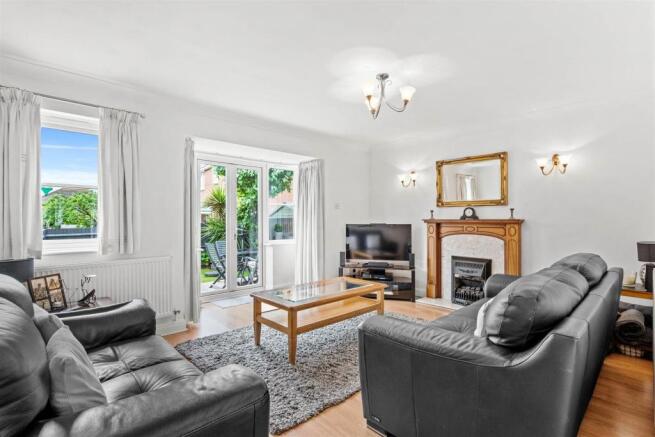 12 Gazala Drive - Sitting room (brochure).jpg