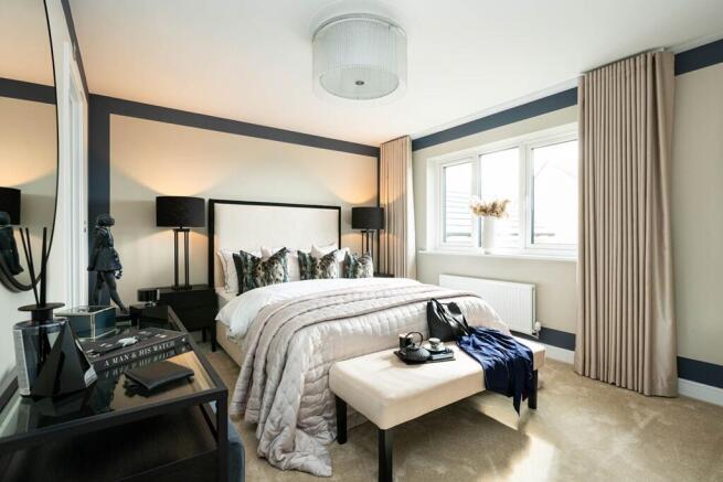 Grand main bedroom which overlooks the rear garden