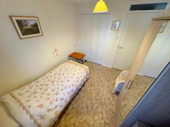 Bed 1 to wardrobe