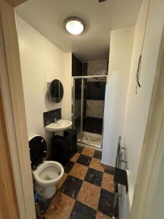 Modern bathroom with stylish checkered tiling...