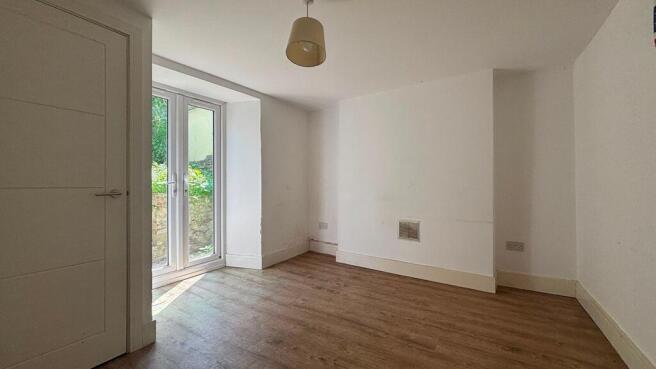 Bright modern room with sleek wood floors...