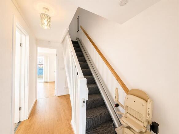 Bright and tidy hallway with sleek flooring...