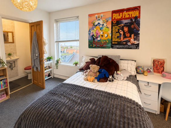 Cozy Bedroom with Plush Toys and Posters.png