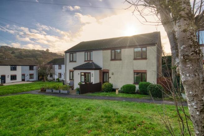 Front of the home and sunburst.jpg