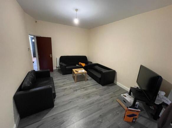 A bright and spacious living room featuring mod...