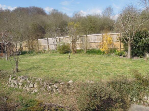 A view of the rear Garden with glimpses of Cop Hea