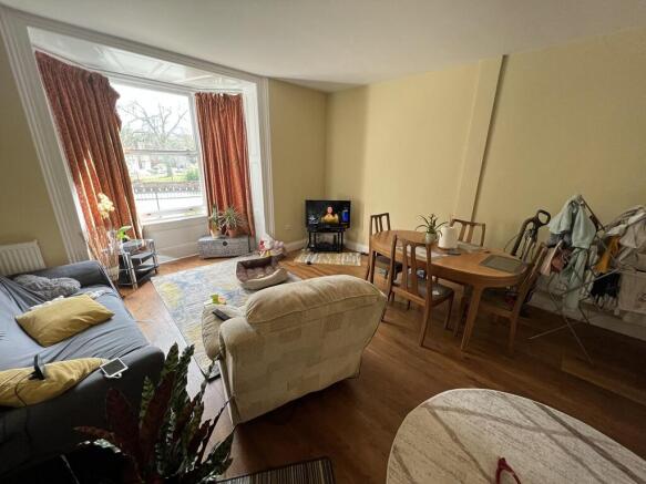 Spacious living room with large bay window...