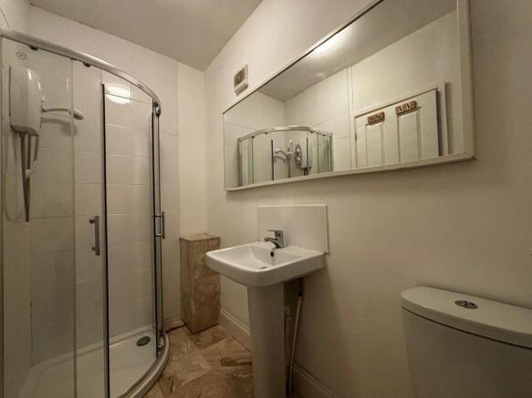 Modern bathroom with sleek curved shower cubicl...