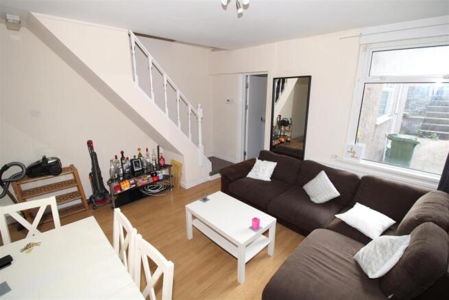 Bright living area with large corner sofa...