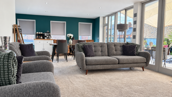 Bright teal-walled interior with natural light-6