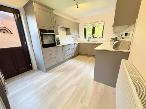 Fitted Kitchen With Utility Area