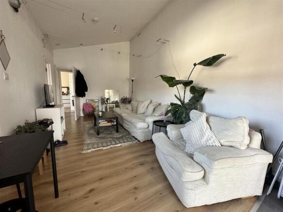 Bright lounge with comfy seating and plants...