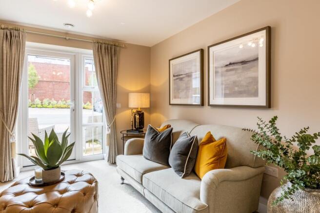 a living room with a couch and a lamp