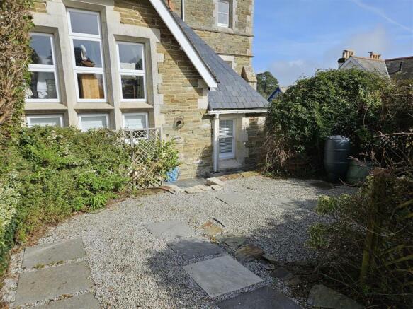 Parking space and rear garden.