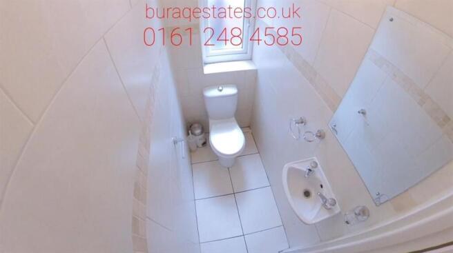 A clean and well-maintained bathroom with a toi...