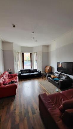 Spacious lounge with plentiful leather seating...