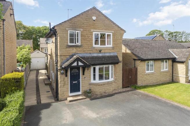 FRONT SHOT AND GARAGE